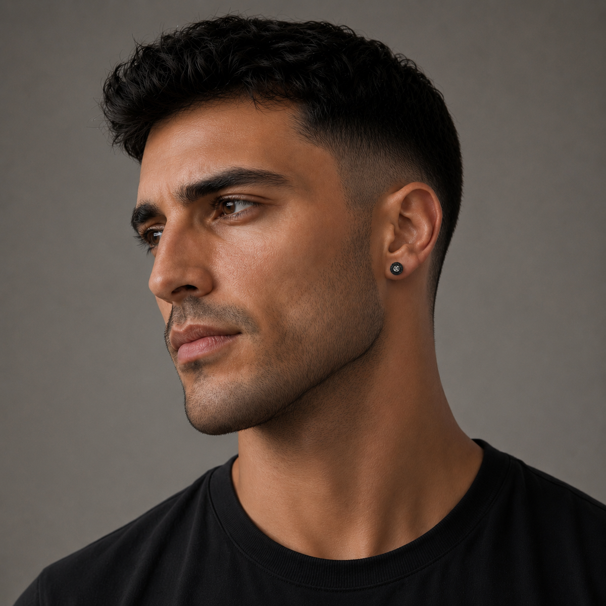 Male model wearing black crystal Greek key stud earring